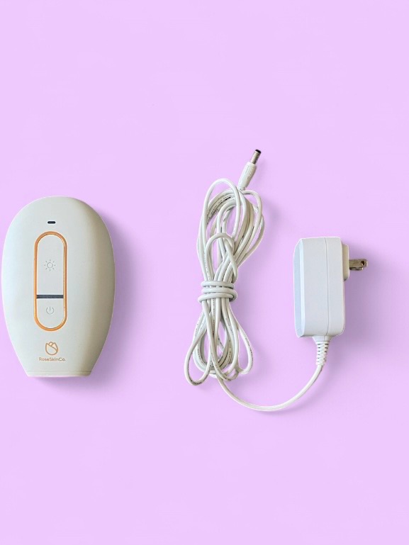 White Handheld Ipl Hair Removal Device With Power Adapter